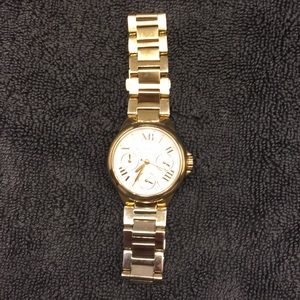 Women’s gold Michael Kors watch